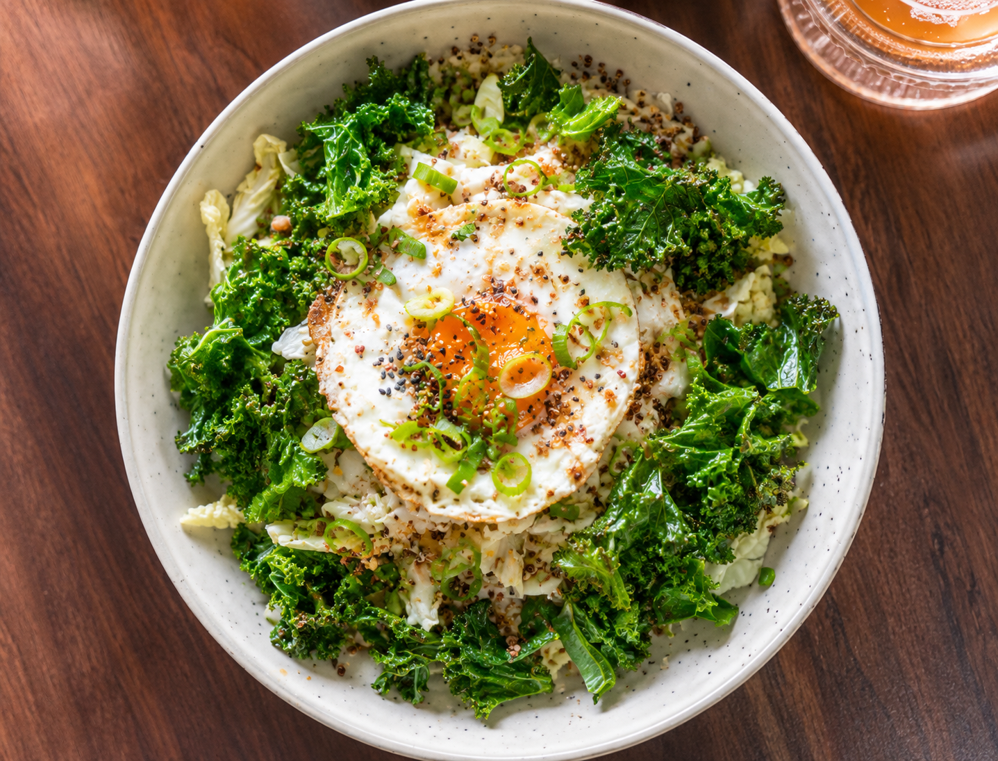 Stevie and Marli savoury porridge with chicken, egg, grilled kale, cabbage and chilli oil