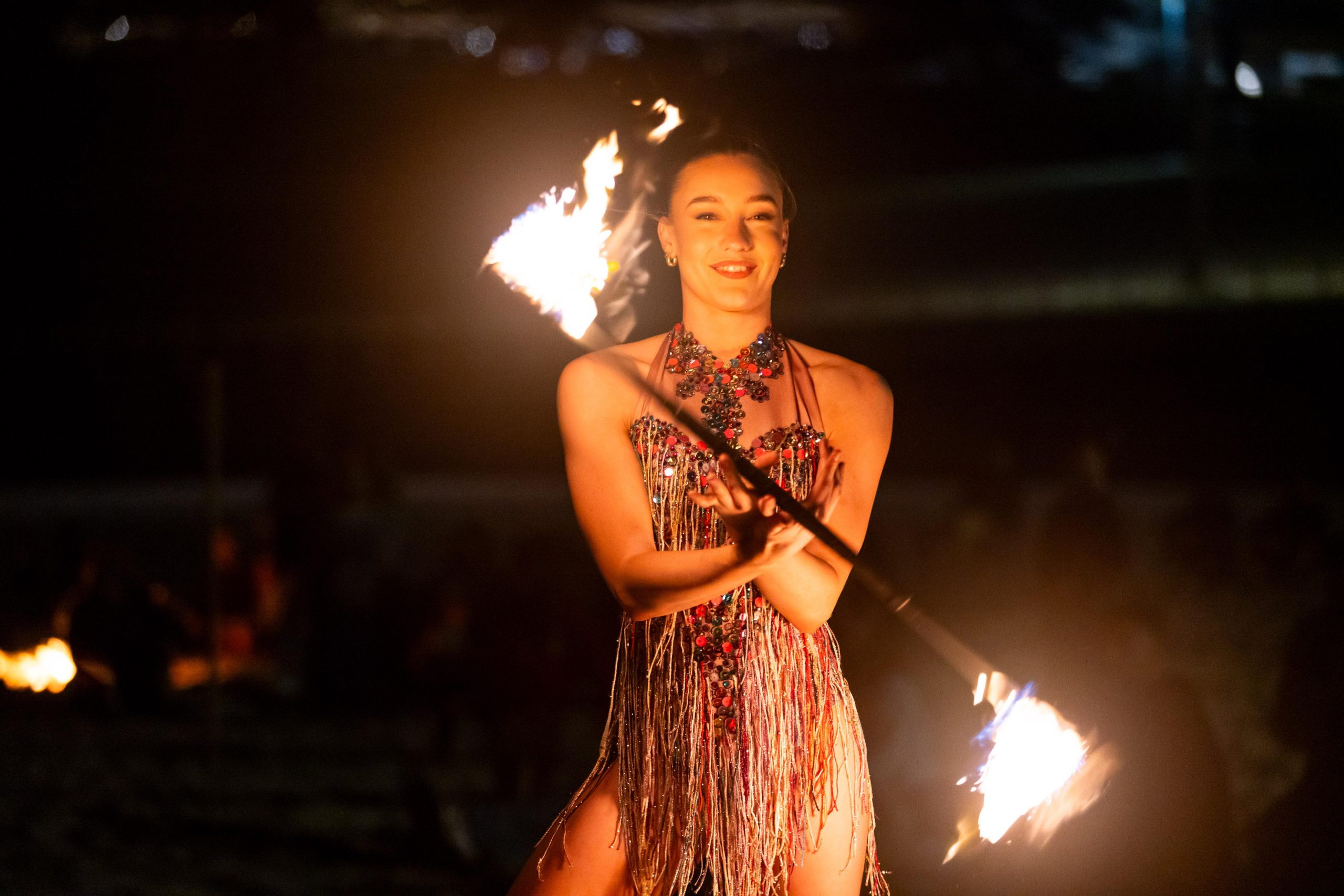 Fire dancer performing at Bondi Firelight on South Bondi Beach