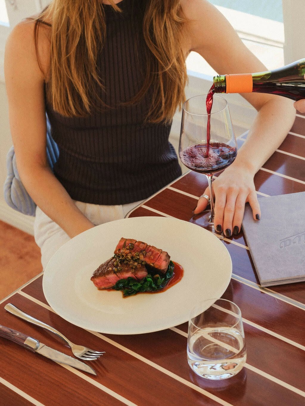 Main course and red wine at Riva Rose Bay