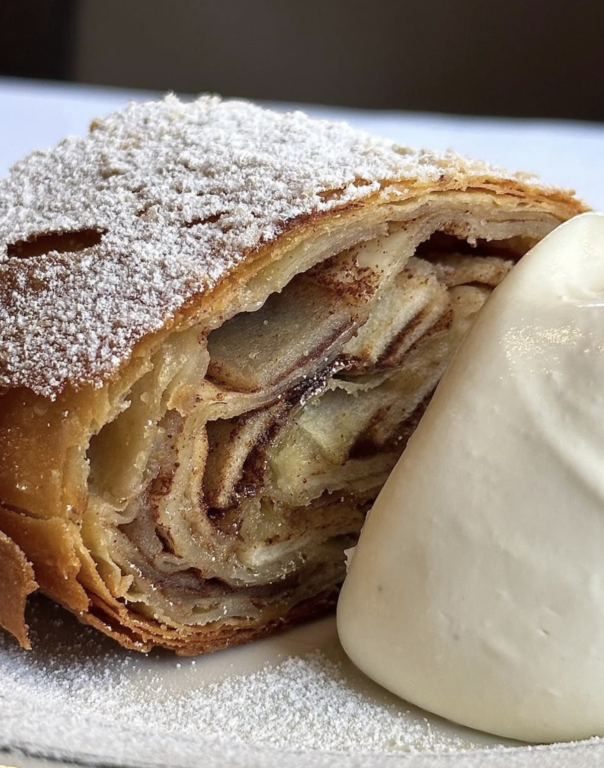 Apple strudel served with cream at Corner 75 Randwick