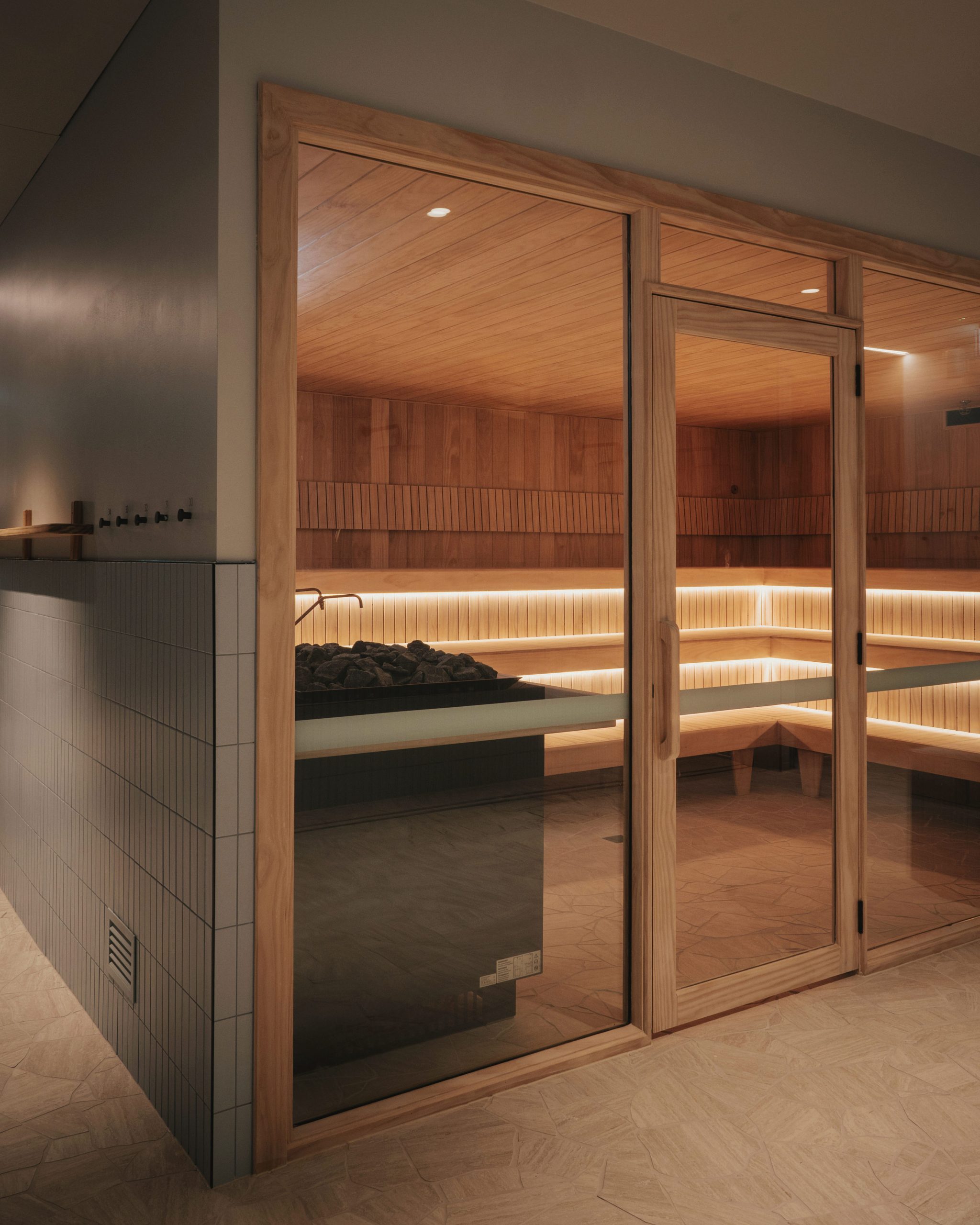 Glass-fronted timber sauna at an XtraClubs wellness club